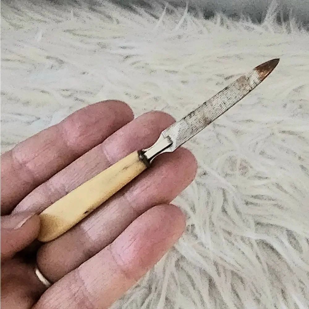 Vintage bakelite possibly vanity nail file 4 inches circa 1920